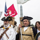 Ralliers at the World War II Memorial during the Million Vet March (Andrew Burton/Getty Images)